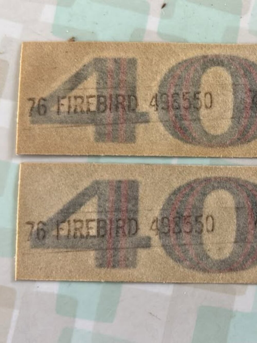 A pair of vintage OEM 1976 Pontiac Firebird Trans Am 400 hood scoop decals with